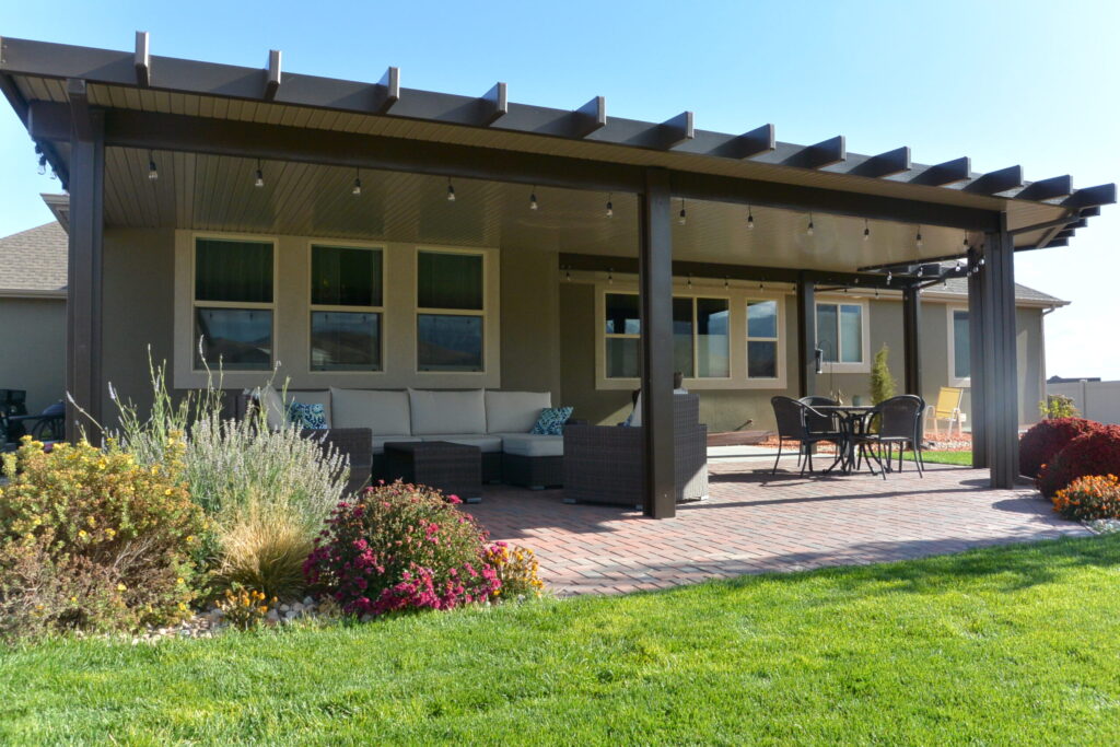DuraCool insulated patio cover providing shade over an Orange County backyard, ideal for relaxing and entertaining outdoors