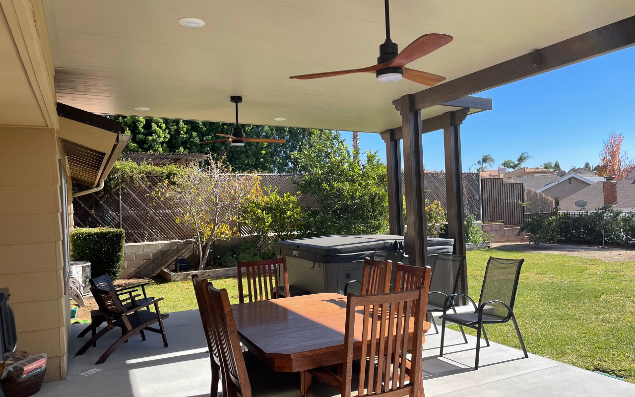 Elegant aluminum patio cover in Orange County designed to look like natural wood — combining style, durability, and low maintenance.