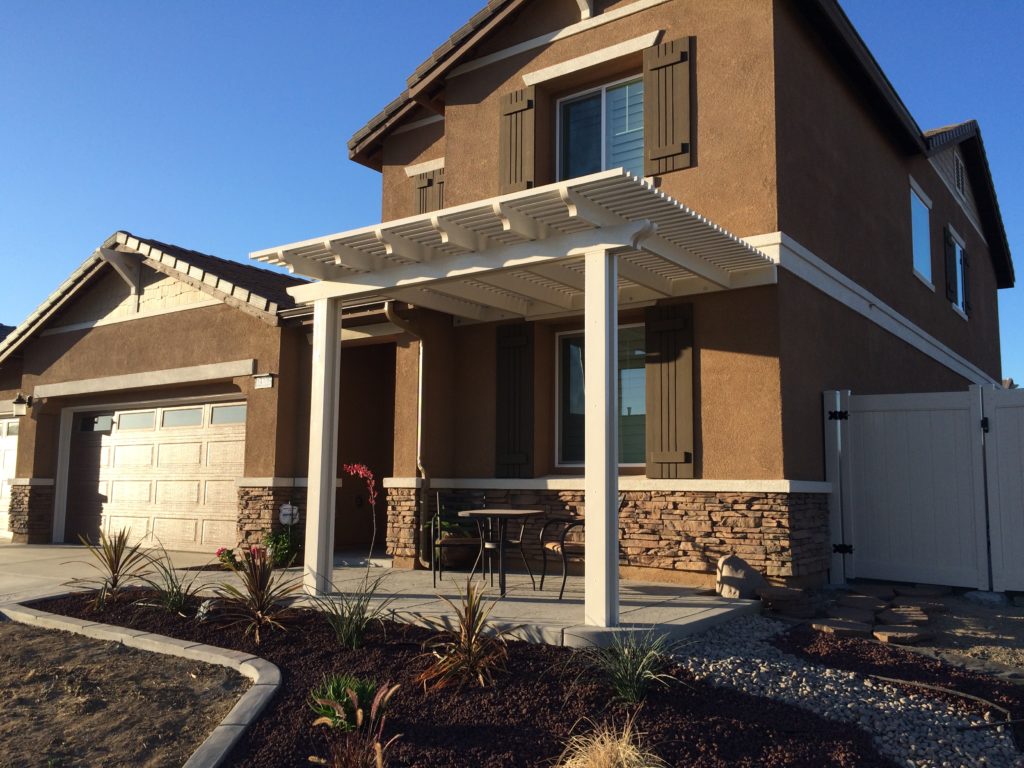 Alumawood open lattice patio cover attached to home creating stylish shaded patio space in Orange County