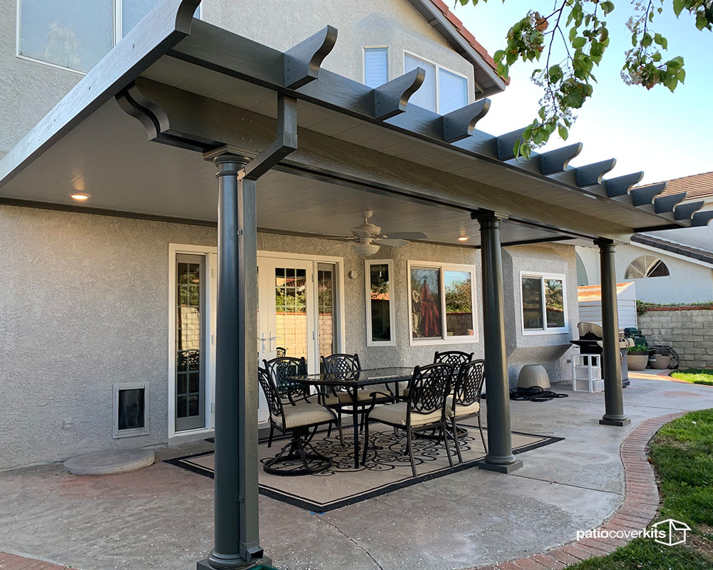 outdoor patio dining area under an Alumawood insulated patio cover in Orange County CA with table seating and full overhead shade