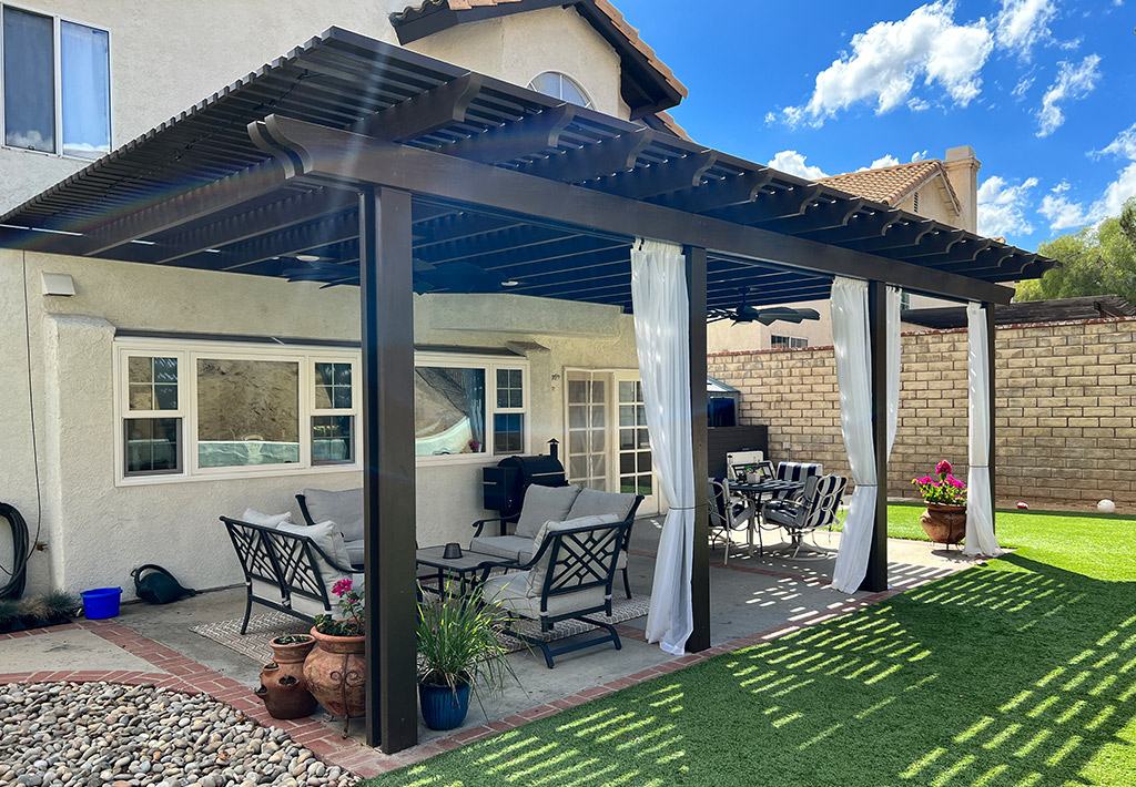 modern Alumawood lattice patio cover with wood-like finish installed over outdoor dining space in Orange County backyard